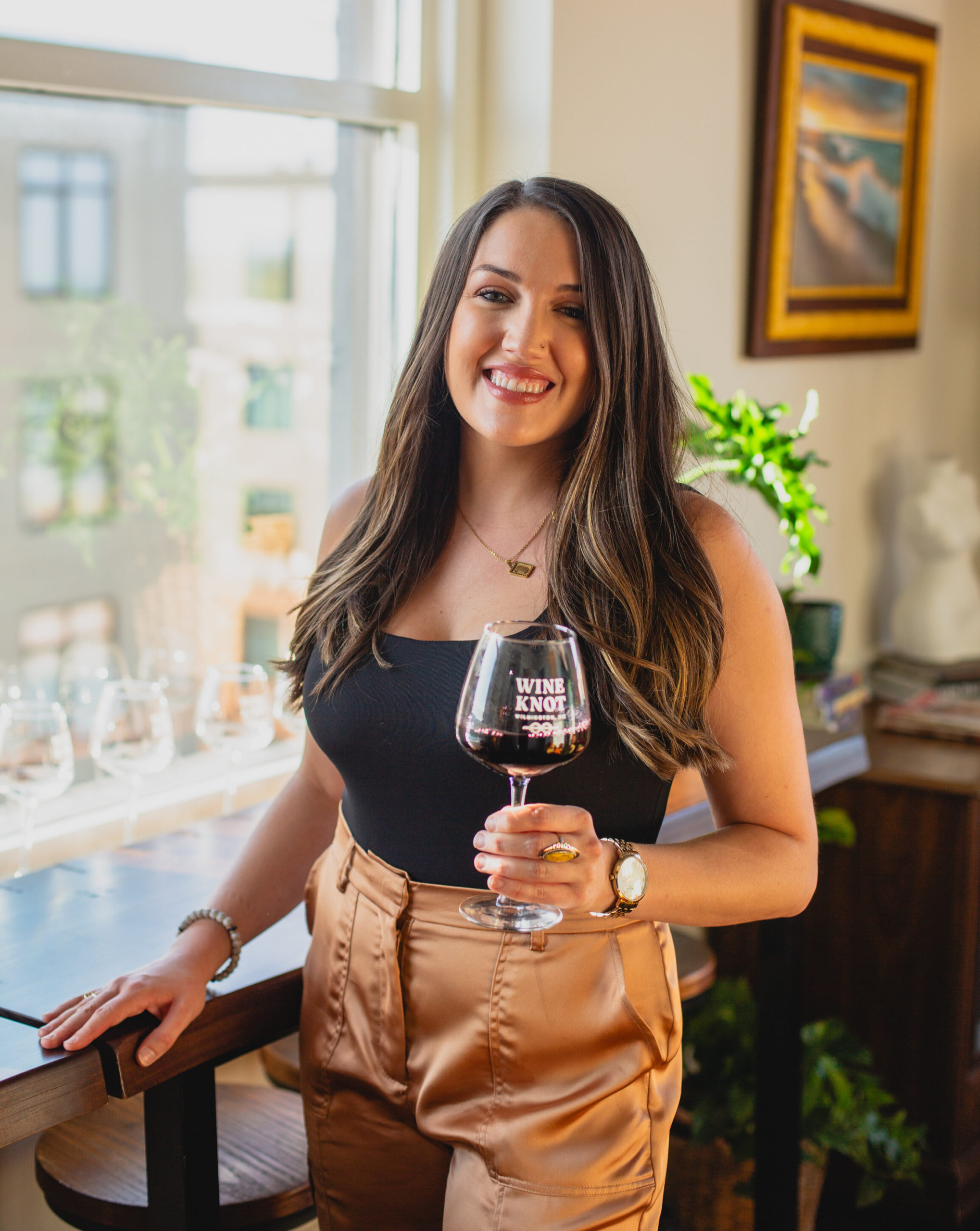 Guest enjoying a glass at Wine Knot